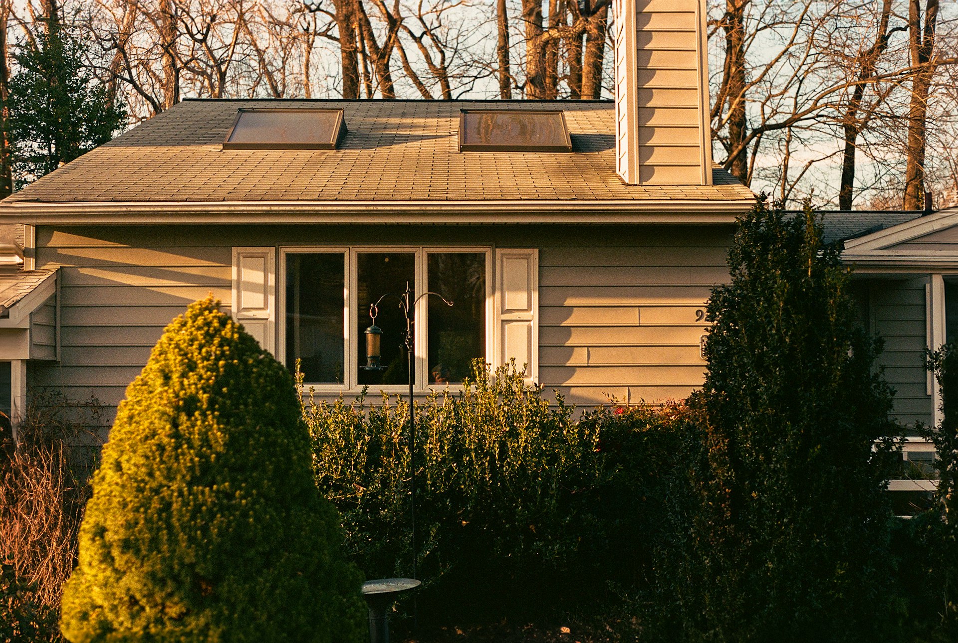 a house with a clock on the front of it
